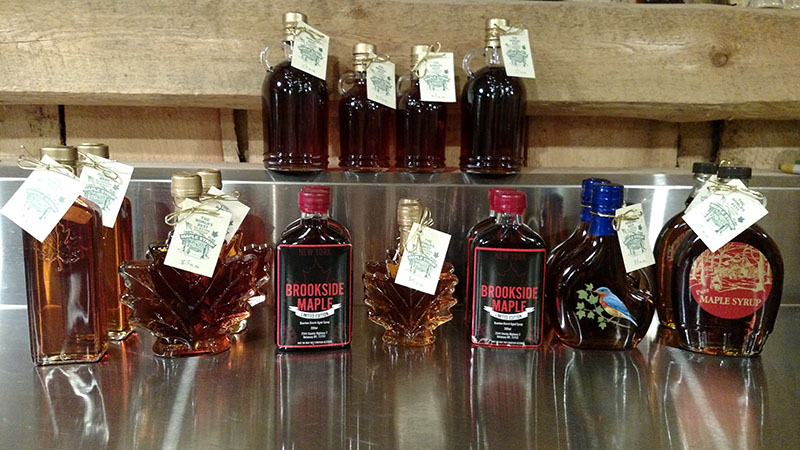 fancy glass bottles of maple syrup